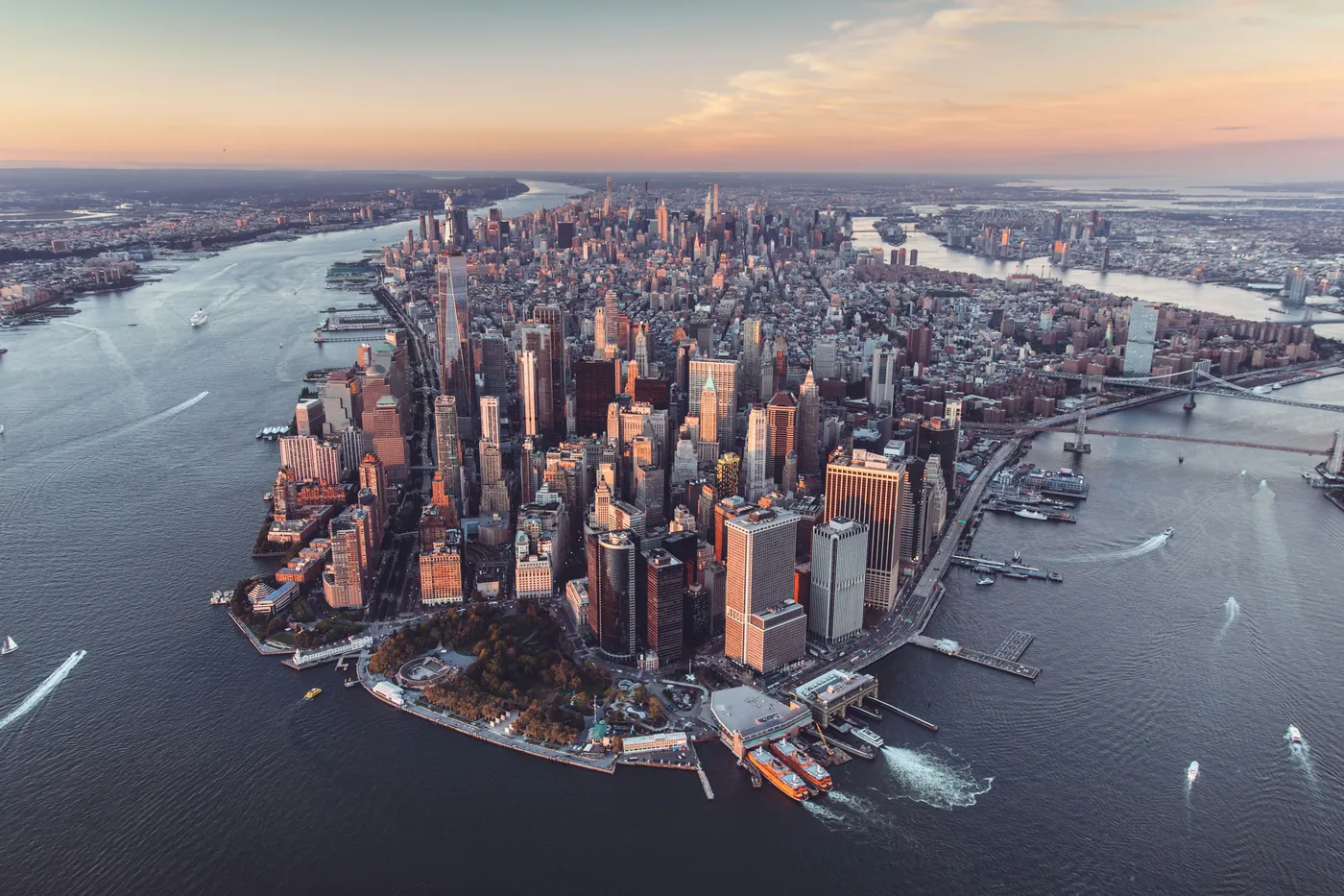 Lower Manhattan aerial view at sunset with Hudson and East River framing the skyline